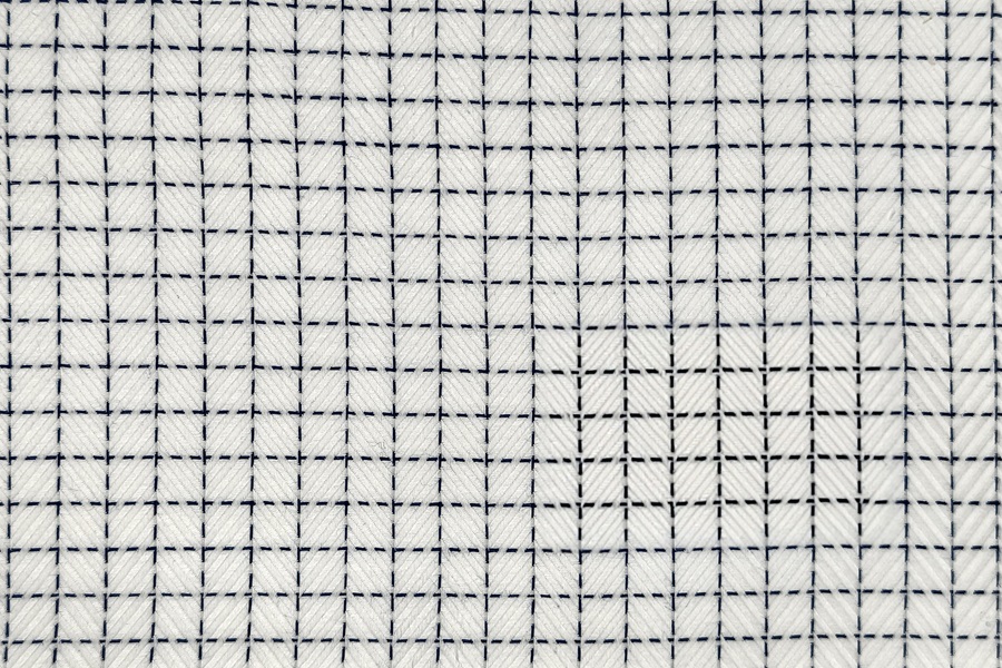 White herringbone in dotted blue squares