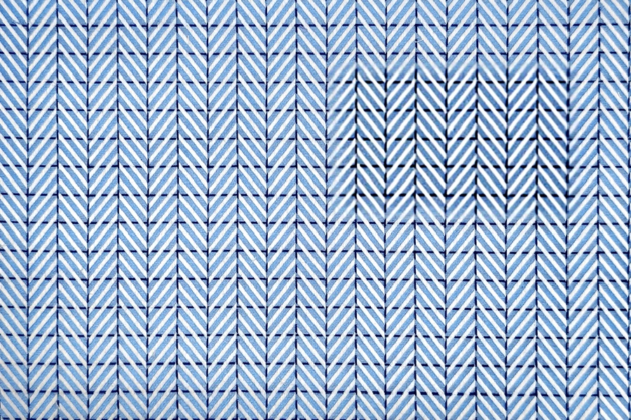 Blue herringbone in dotted blue squares